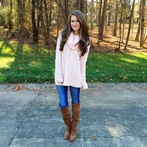 White chunky knit sweater with cable pattern, blue jeans and overknee boots
