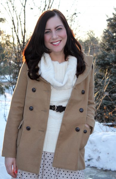 White cowl neck sweater with belt and pink wool coat