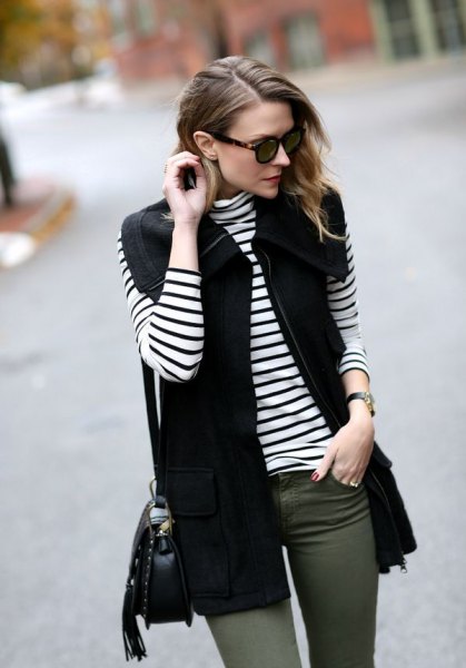 Black vest with striped long sleeve t-shirt and gray skinny jeans