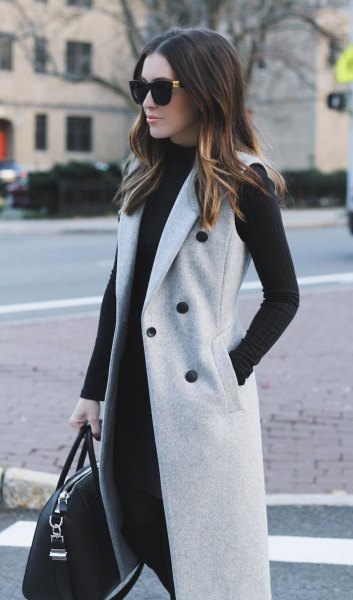 gray sleeveless double-breasted wool coat with black shift dress