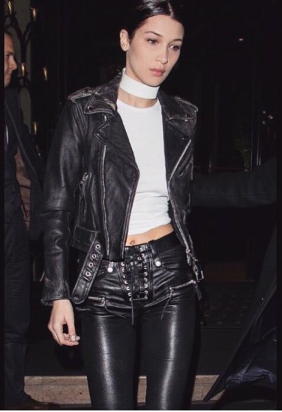 Black leather jacket with short t-shirt and biker pants