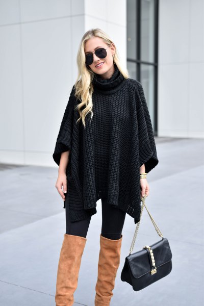 Black cable knit turtleneck and camel over the knee boots