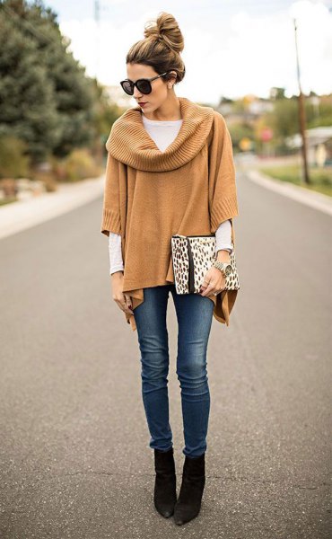 Camel ribbed poncho sweater with sleeves and black pointed toe ankle boots
