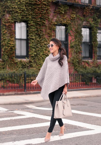 Gray turtleneck cape sweater and black slim fit trousers