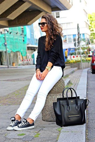 Navy and white low shoes with white slim fit jeans