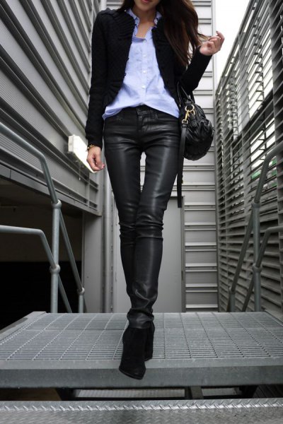 Black blazer with light blue button down shirt and leather coated jeans