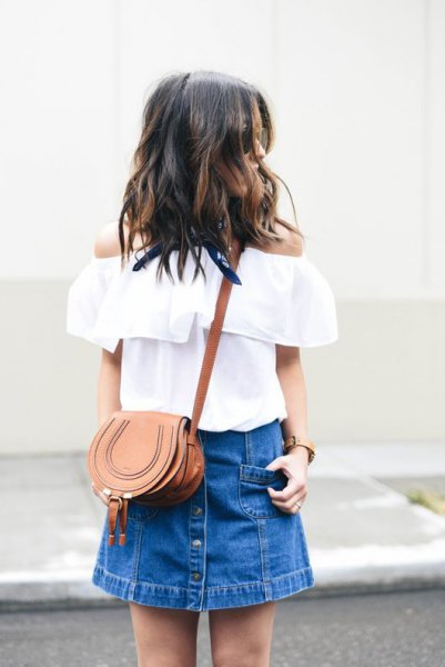 White off the shoulder blouse with blue mini denim skirt