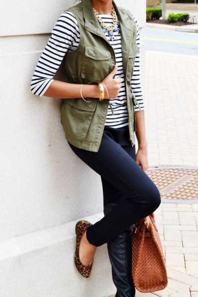 Black and white striped t-shirt with three-quarter sleeves, vest and dark jeans