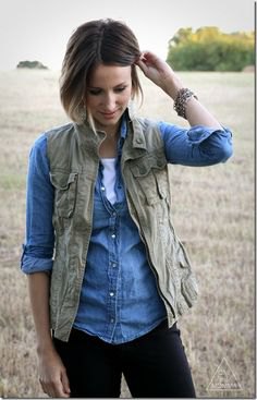 olive green waistcoat with light blue chambray shirt and dark jeans