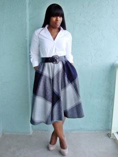 White button down shirt and gray plaid flared midi skirt with pockets