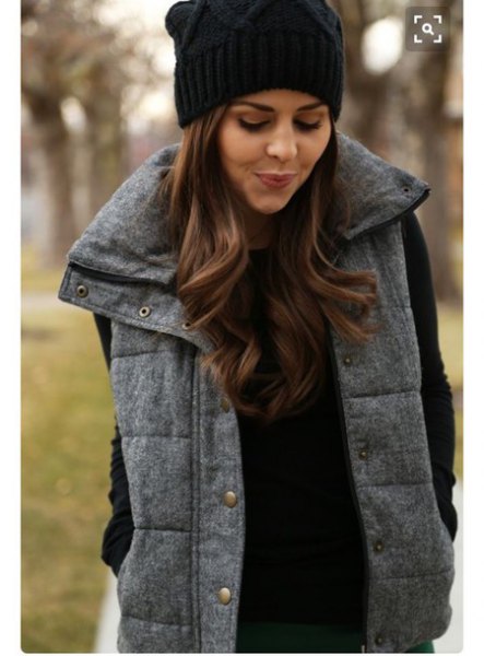 black knit hat with sweater with thick vest