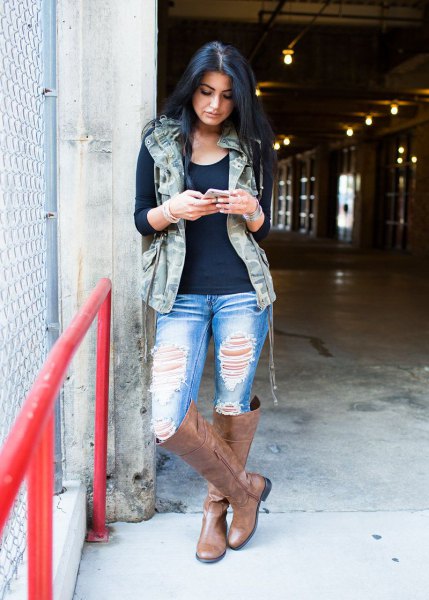 Hooded military vest, black t-shirt and ripped boyfriend jeans
