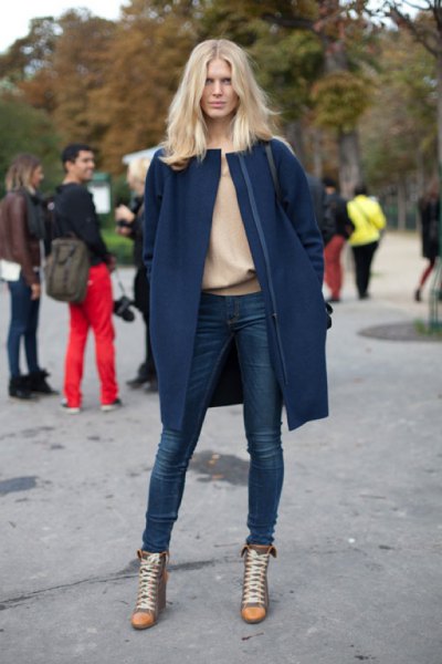 Navy blue long wool coat with pink sweater and super skinny jeans