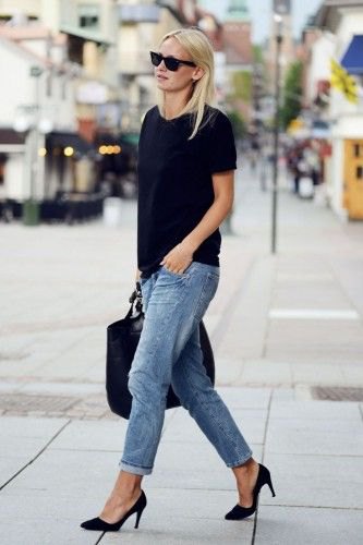 Black t-shirt with blue cuffed loose-fit jeans
