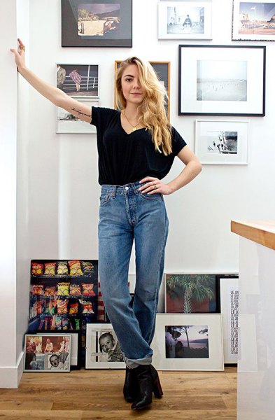 Black V-neck t-shirt and cuffed, high-rise straight-leg jeans