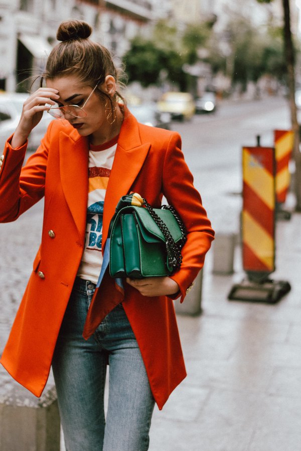 Best orange oversized double breasted blazer with printed t-shirt and gray jeans