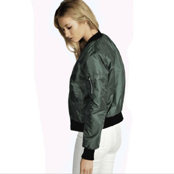 Green bomber jacket with white skinny jeans