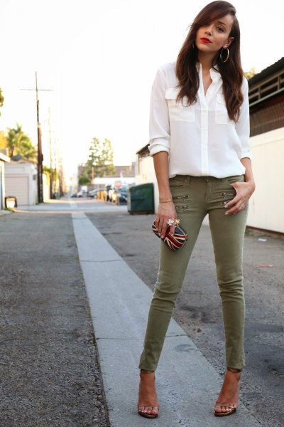 White chiffon blouse with buttons and olive skinny pants