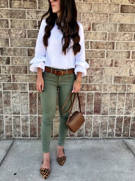 Pair a white ruffle sleeve blouse with olive skinny jeans