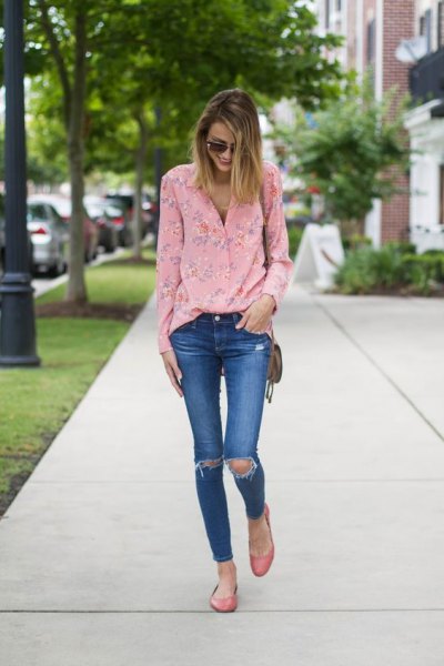 Blush floral blouse and blue ripped skinny jeans