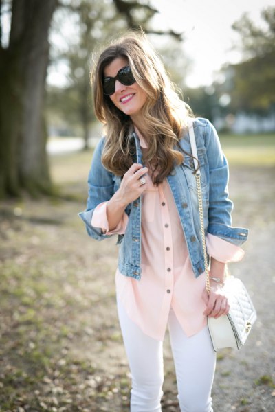 blue denim jacket with blush silk blouse and white jeans