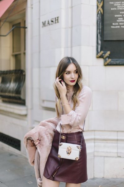 blush pink blouse with black leather mini skirt