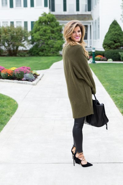 Green long sleeve oversized tunic sweater with black leather leggings