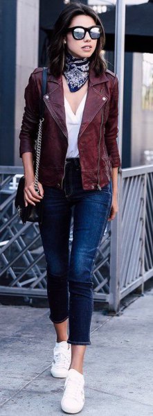 Moto jacket with white V-neck blouse and cropped jeans