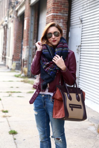 Burgundy leather jacket with black and blue plaid scarf