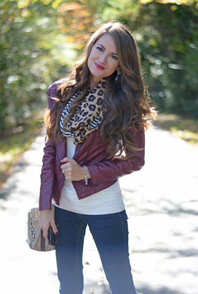 Leather jacket with leopard print scarf and skinny jeans