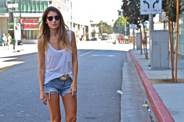 White scoop neck tank top and denim cut-off shorts