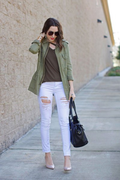 Olive green casual jacket with a green V-neck top and white skinny jeans