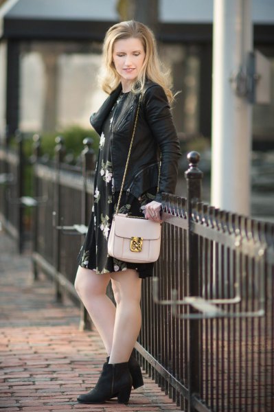 Leather jacket with black floral swing mini dress and heeled boots