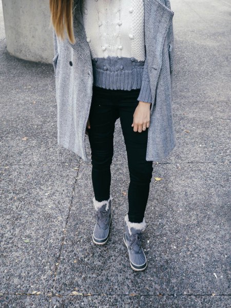 gray and white block knit sweater with black jeans
