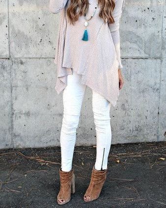 Light gray knit tunic top with white zip leg jeans
