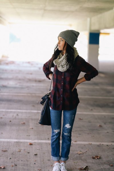 Navy blue and dark green plaid shirt with blue ripped flannel-lined jeans