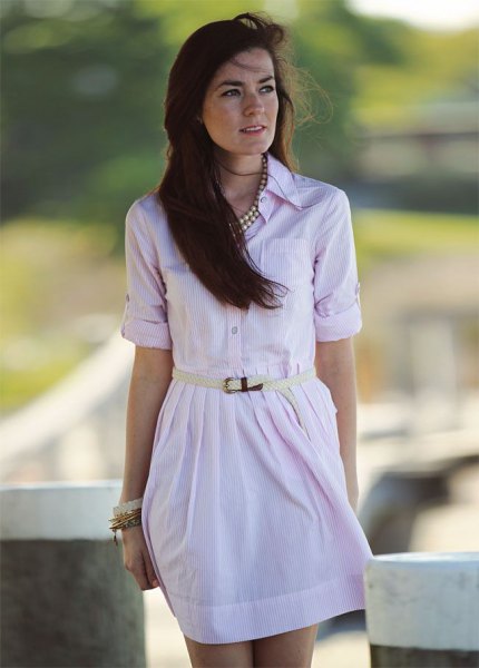 Light pink mini dress with buttoned belt and statement silver necklace
