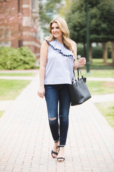Light blue sleeveless one shoulder top with ruffles and skinny jeans