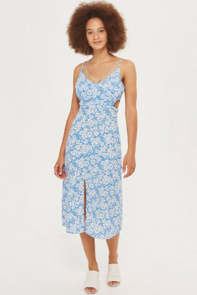 Aqua blue and white floral print V-neck midi dress with white open
toe shoes