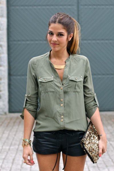 Army green button down shirt and black leather mini shorts