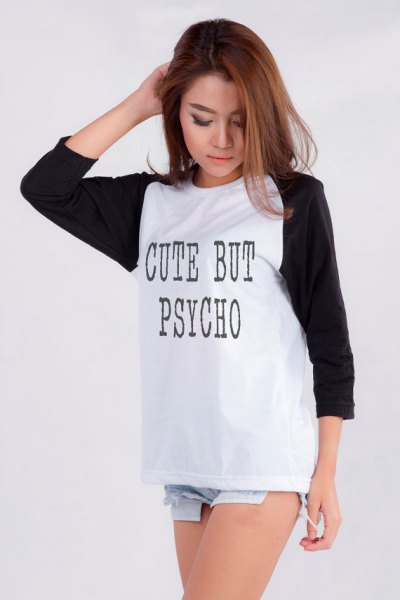 Black and white long sleeve graphic tee paired with light blue denim mini shorts
