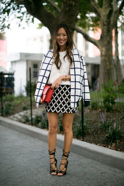 Black and white checked wool coat with black lace-up heeled sandals