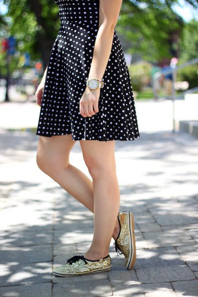 Black and white polka dot fit and flare mini dress with gold sequin sneakers