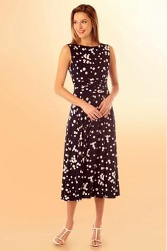 Black and white polka dot mid-length dress with open toe heels