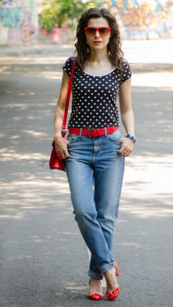 Black and white polka dot t-shirt with light blue cuffed jeans
