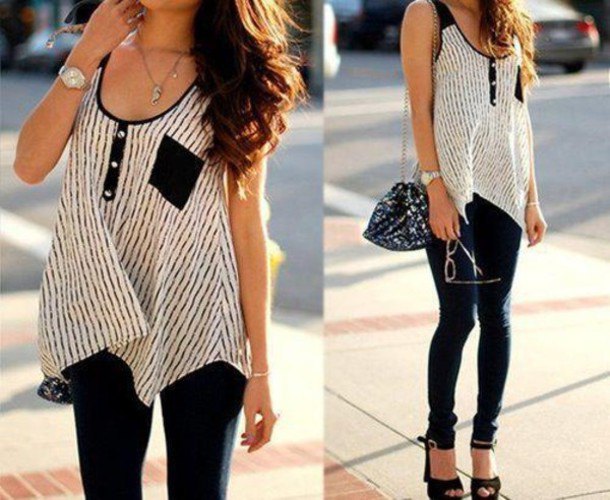 Black and white sleeveless scoop neck tunic top paired with skinny jeans