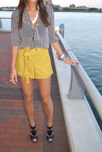 Black and white striped blouse with a mustard yellow mini skirt