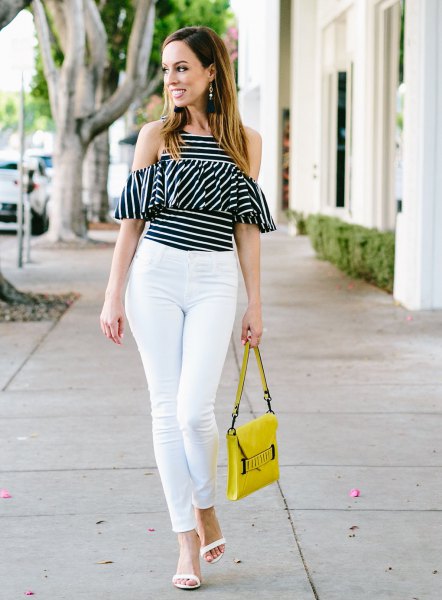 Black and white striped off shoulder ruffle top with yellow leather
handbag