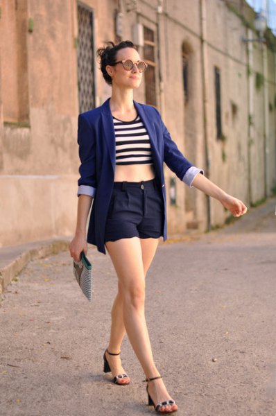 Black and white striped crop top worn with a dark blue blazer and
matching scalloped hem shorts