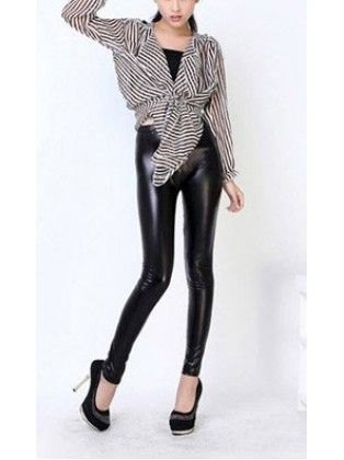 Black and white striped knotted blouse with leather leggings and high heels